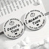 Two double-sided decision coins labeled New Parent Decision Coin Daddy's Turn and Mummy's Turn Flip for Your Fate