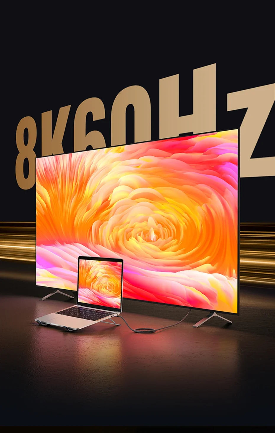A laptop displaying a vibrant orange and pink swirl pattern is positioned in front of an 8K monitor.