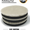 A stack of black and white polishing pads with foam backing for car care.