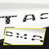 3D letter emblem for Toyota Tacoma tailgate featuring the letters TAC and OMA