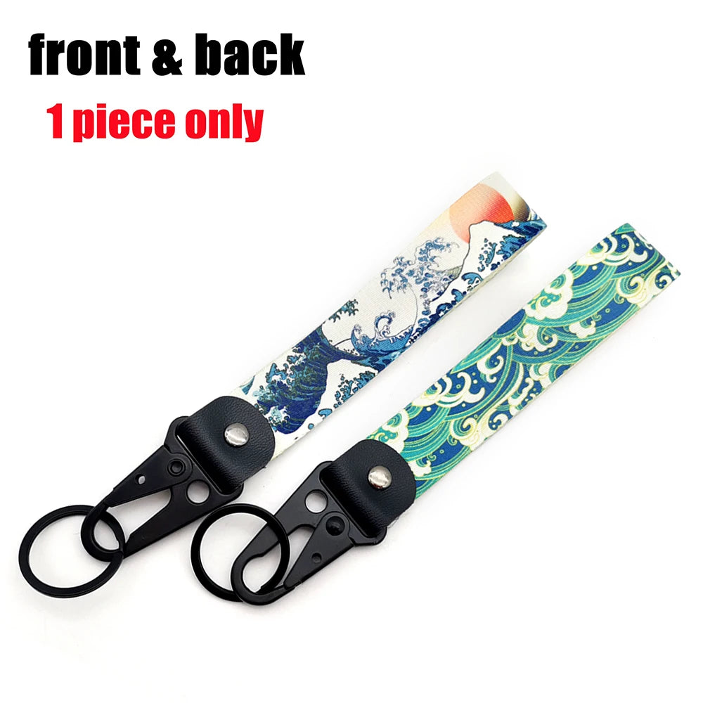 A single piece of Hokkaido Wave JDM keychain featuring a Kanagawa surf design on a strap.