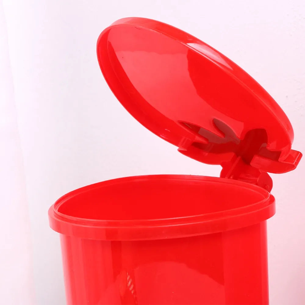 A bright red mini strawberry trash can with a pop-up lid shown open.