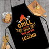 Black apron with orange text featuring a grill master theme and fire icon