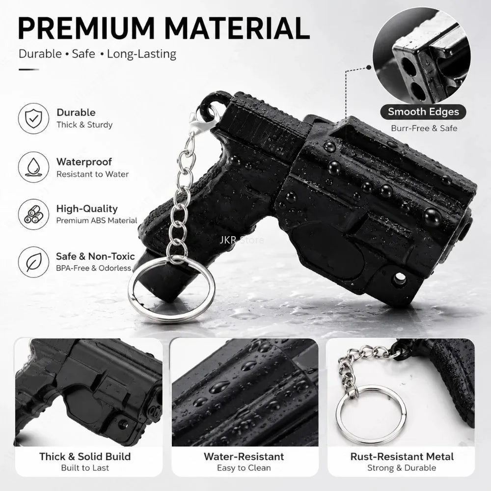 Black 3D printed mini pistol-shaped keychain set with a silver chain and various features highlighted.