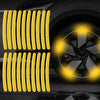 Yellow reflective strips installed on a car wheel rim for visibility.