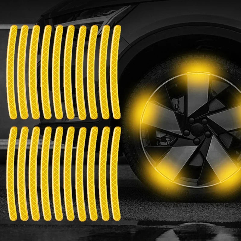 Yellow reflective strips installed on a car wheel rim for visibility.