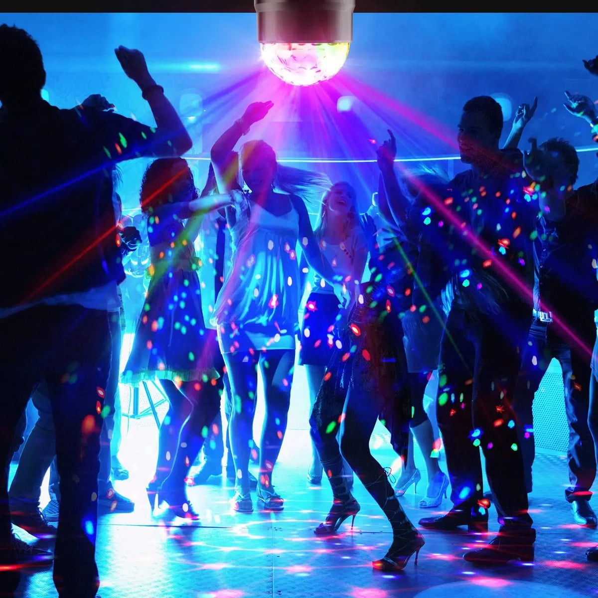 Performers under a bright spotlight illuminated by an RGB LED disco ball light during a concert or performance.