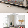 A gray chenille sofa cover decorated with Christmas tree patterns, red and white accents, and gold embroidery.
