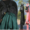 A black backpack with a green fabric item and an adjustable luggage hanging strap.