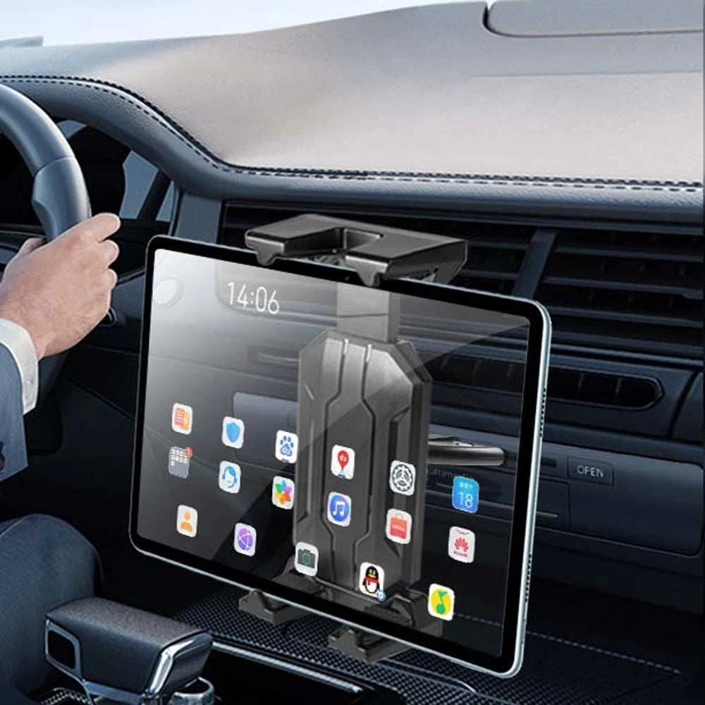 A tablet mounted in a car dashboard slot, showing various app icons.