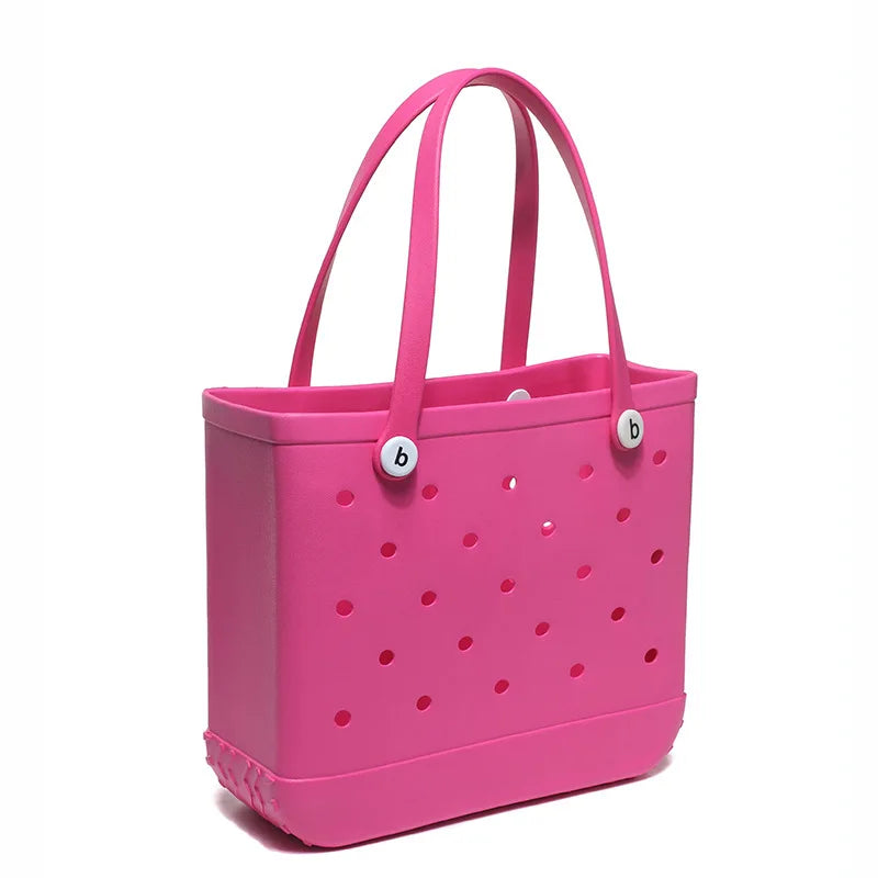 Helle pinke, portable EVA-Strandtasche mit Henkeln und kleinen Löchern.