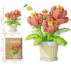 A set of pink and yellow flower building blocks featuring roses, sunflowers, and carnations in pots.