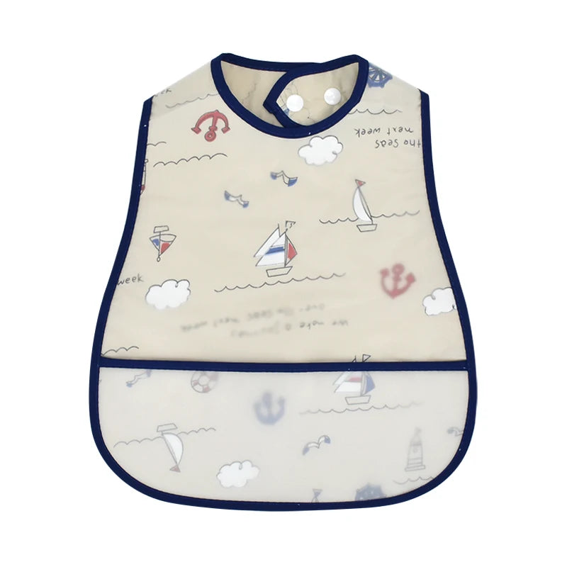 A beige waterproof baby feeding bib with a catch pocket and various sea-themed illustrations.