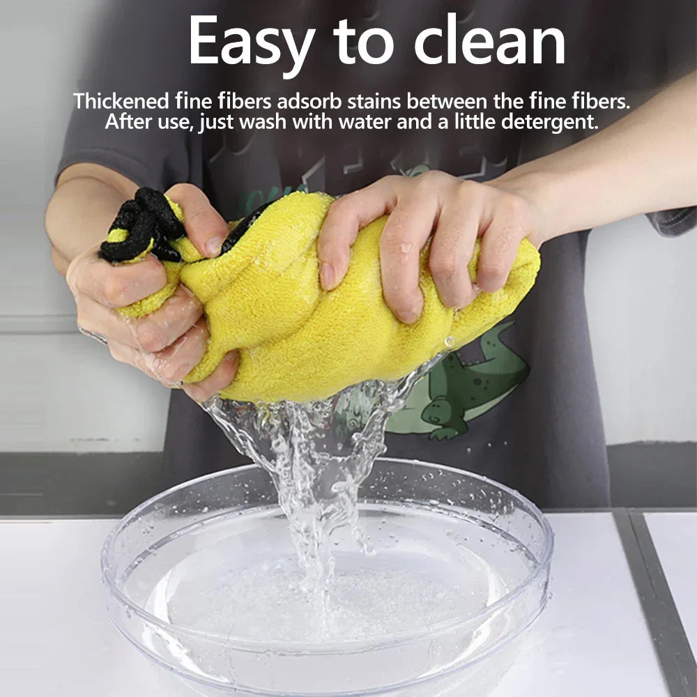 Hands are washing a yellow cleaning towel in a bowl of water, demonstrating its easy to clean feature.