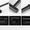 A set of black stainless steel bathroom towel racks shown in different configurations including a base, hanging rod, and arc/