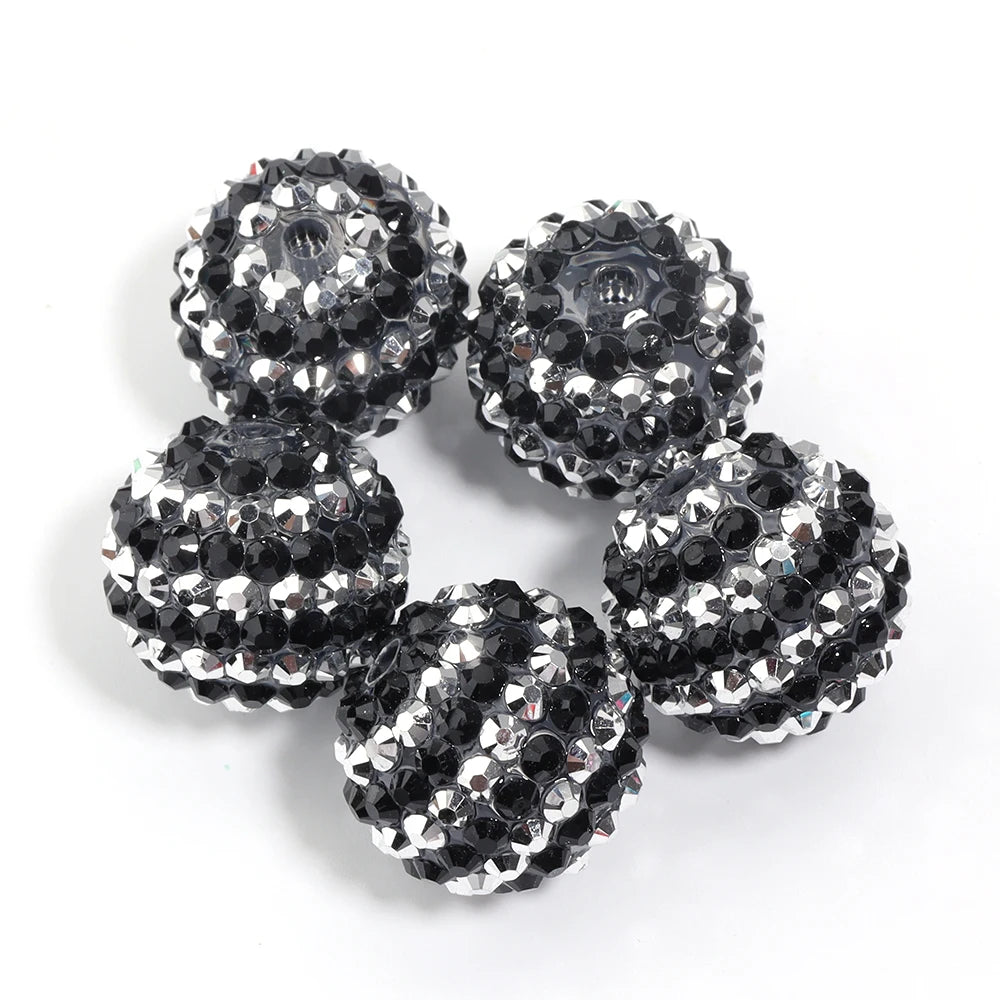 A set of five two-tone striped resin rhinestone beads, featuring silver and black, displayed against a white background.