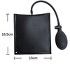 Black inflatable air wedge tool with a flexible hose for car door and window repair