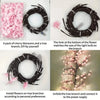 A pack of cherry blossoms and a tree branch used to create a DIY lamp