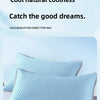 Light blue cooling bean pillowcases and a fitted sheet type mat displayed on a white surface.