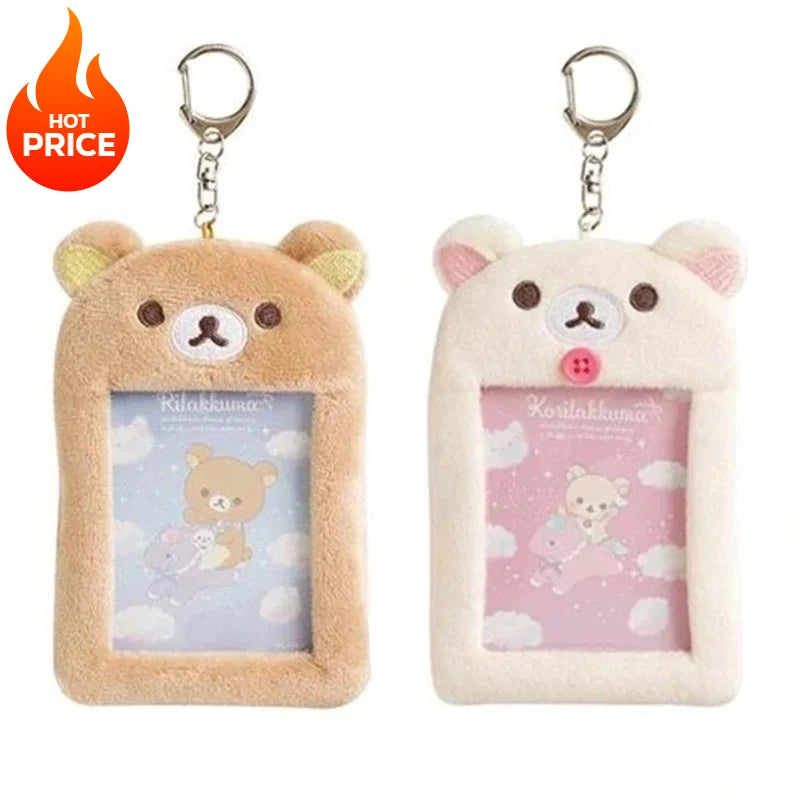 A pair of Rilakkuma plush ID card holders and keychains, one in beige and one in white.