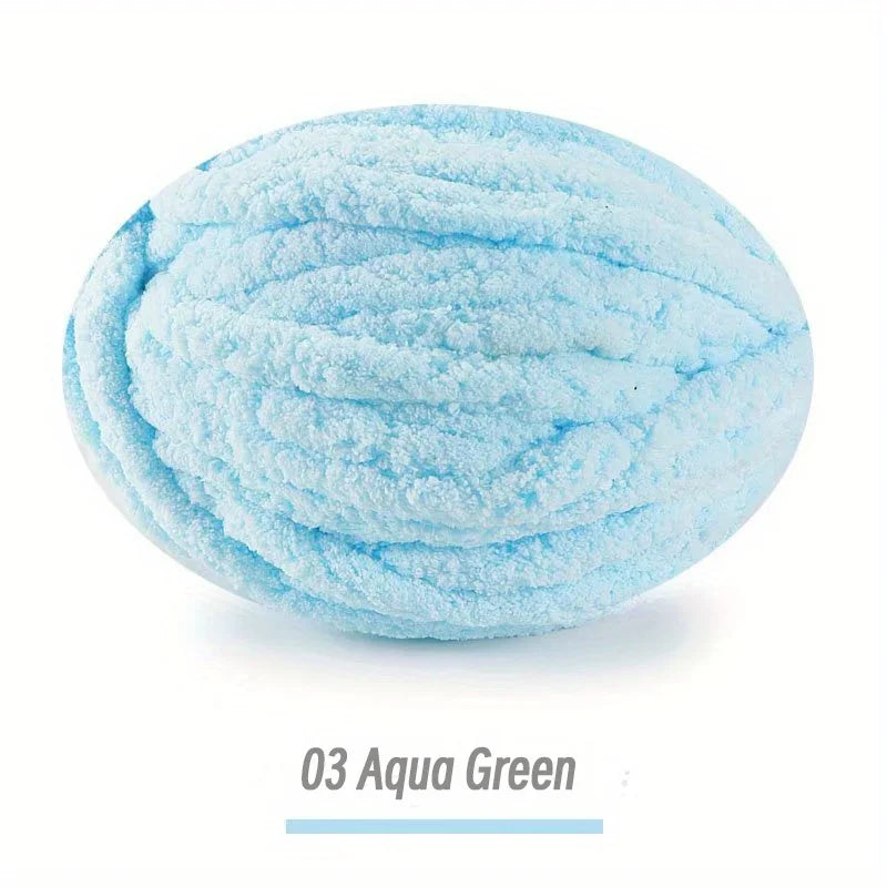 A ball of light blue aqua green chenille yarn for hand knitting