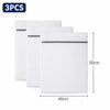 Three white mesh laundry bags with silver zippers are shown, packaged as a 3-pack.