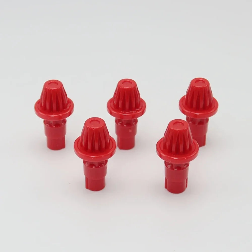 A set of five red replacement drivers for a battling top, used in a game or toy.