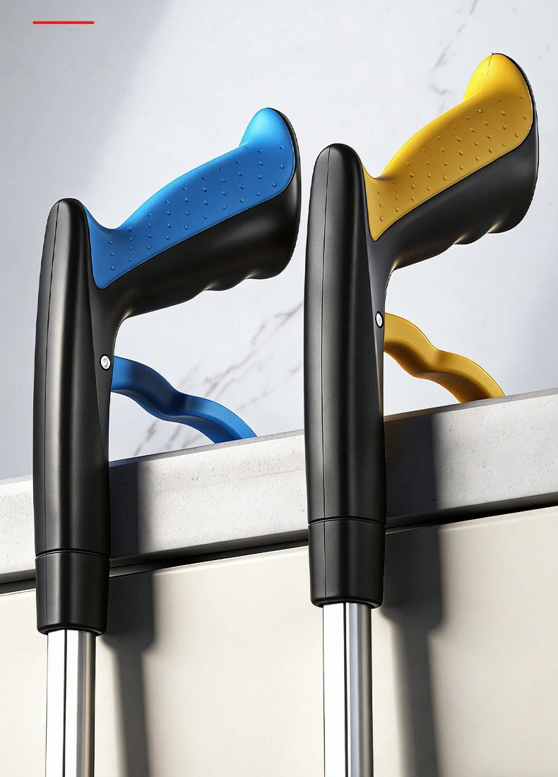 A pair of black and yellow foldable reacher grabber tools are shown against a white background.