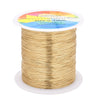 Spool of gold-colored copper clad steel wire for crafts and jewelry making