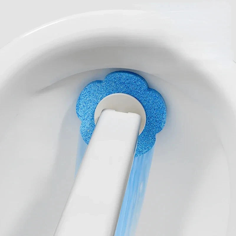A white toilet bowl with a blue, sparkly disposable toilet brush and holder inserted into the water.