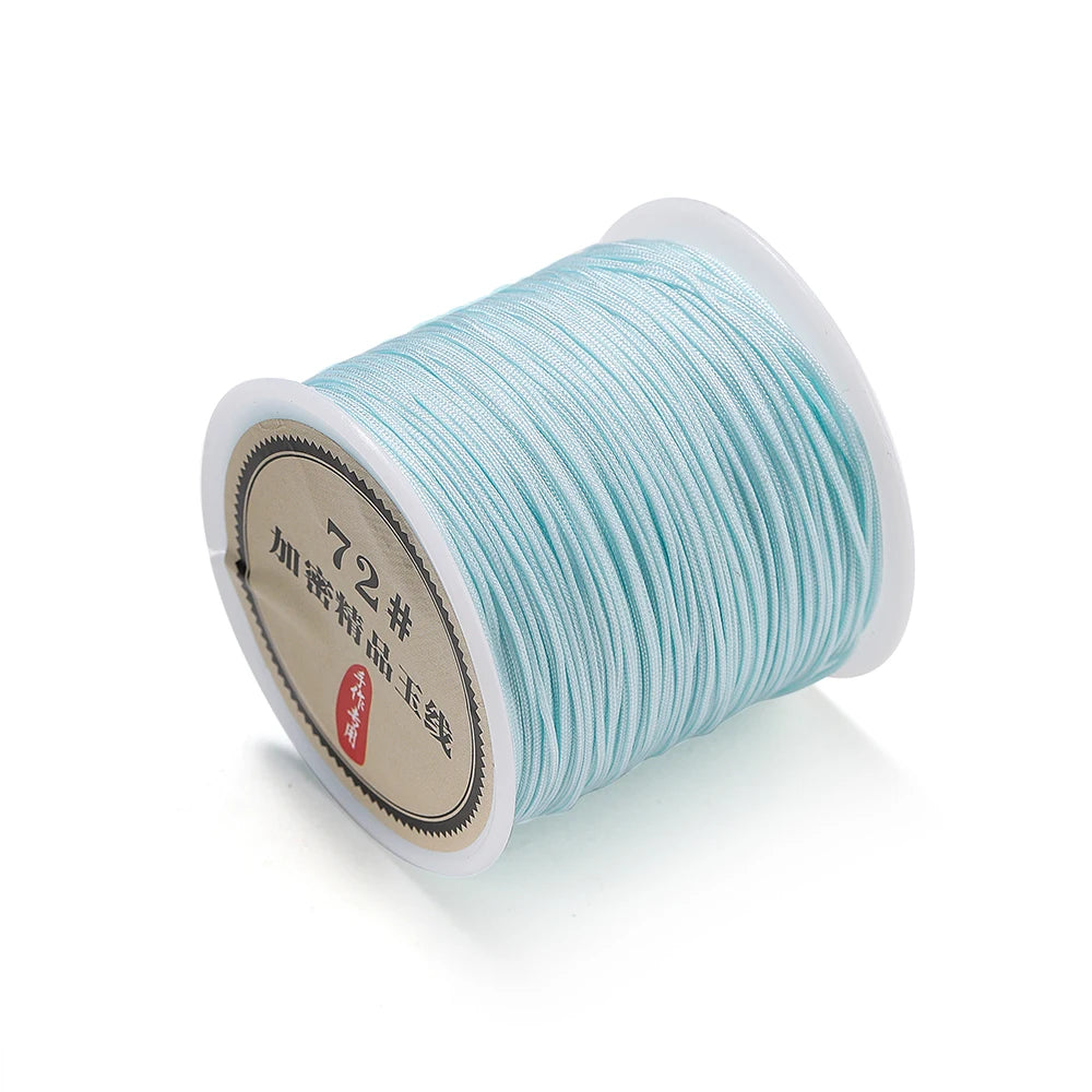 Spool of light blue 0.8mm nylon macramé cord for jewelry making