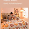 A woman is relaxing on a bed covered with a floral quilt in a bright room, listening to winter whispers.