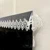 Black table runner with white embroidered mesh lace featuring delicate pendants