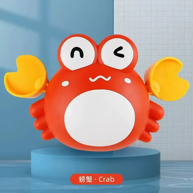 An orange cartoon crab wind-up bath toy with large eyes and yellow claws sitting on a blue stand.