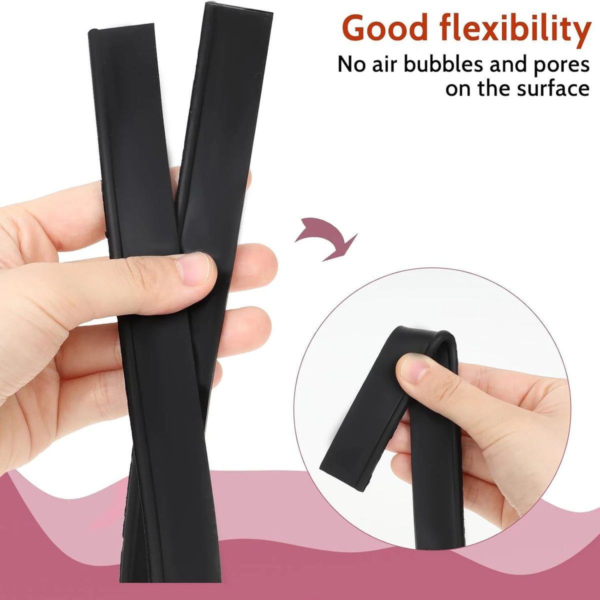 A hand holds a pair of black squeegee replacement rubber blades for window and shower cleaning.