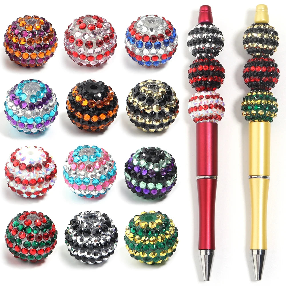 A collection of five resin rhinestone beads in various colors and patterns, including red, silver, blue, black, and green.