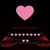 Pink honeycomb heart stickers floating above a red car with glowing red accents.