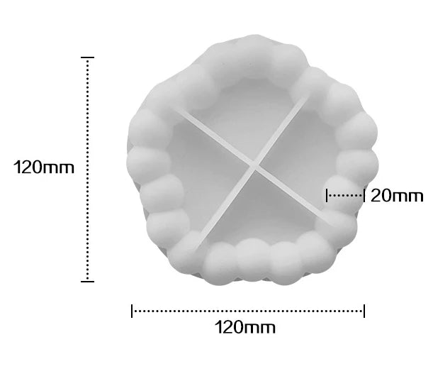 A white silicone tray mold with a fluted edge and a cross-shaped depression, shown with dimension lines.