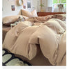 A beige duvet cover set is displayed on a bed, featuring soft, skin-friendly bedding and natural light.