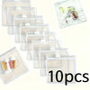 A clear plastic organizer bag containing ten small medical items like bandages and gauze pads.