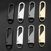 A set of eight universal metal zipper sliders or replacement parts shown against a dark background.