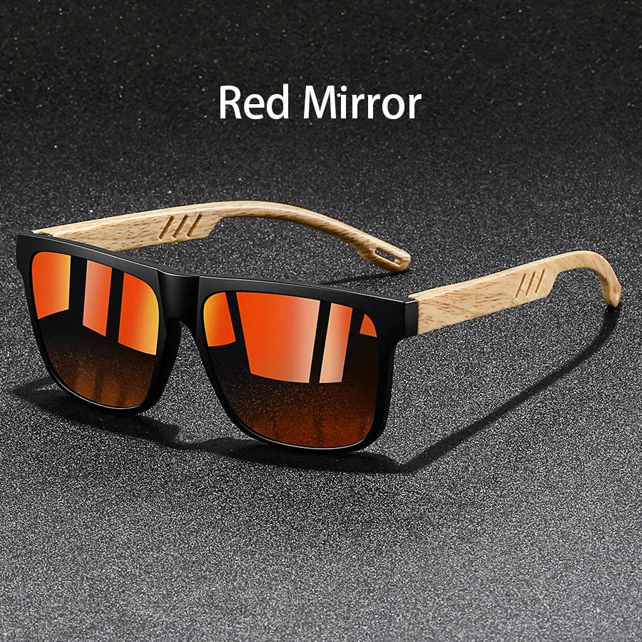 A pair of vintage square sunglasses with orange lenses and wooden frames displayed on a dark surface.