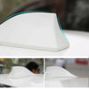 White shark fin car antenna with a blue accent, shown from the side and in close-up views.