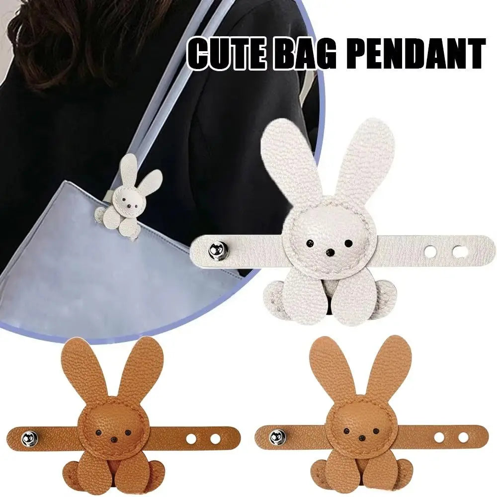 A set of cute bunny bag pendants in white and brown colors for bag charms or keychains.