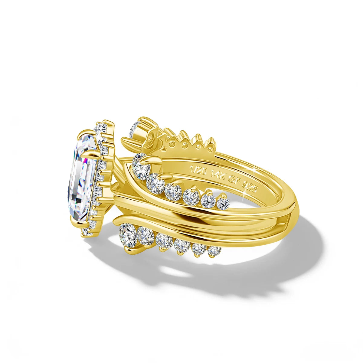 A stackable ring set featuring a prominent emerald cut moissanite stone and surrounding pave diamonds, crafted in 14K gold fi