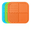 A set of silicone lick mats for dogs and cats in blue, green, and orange.