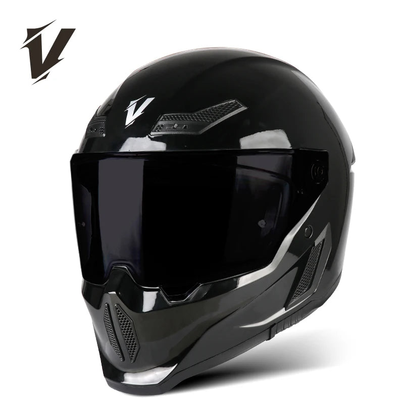 A black full-face motorcycle helmet with a clear visor and ventilation features is shown against a white background.