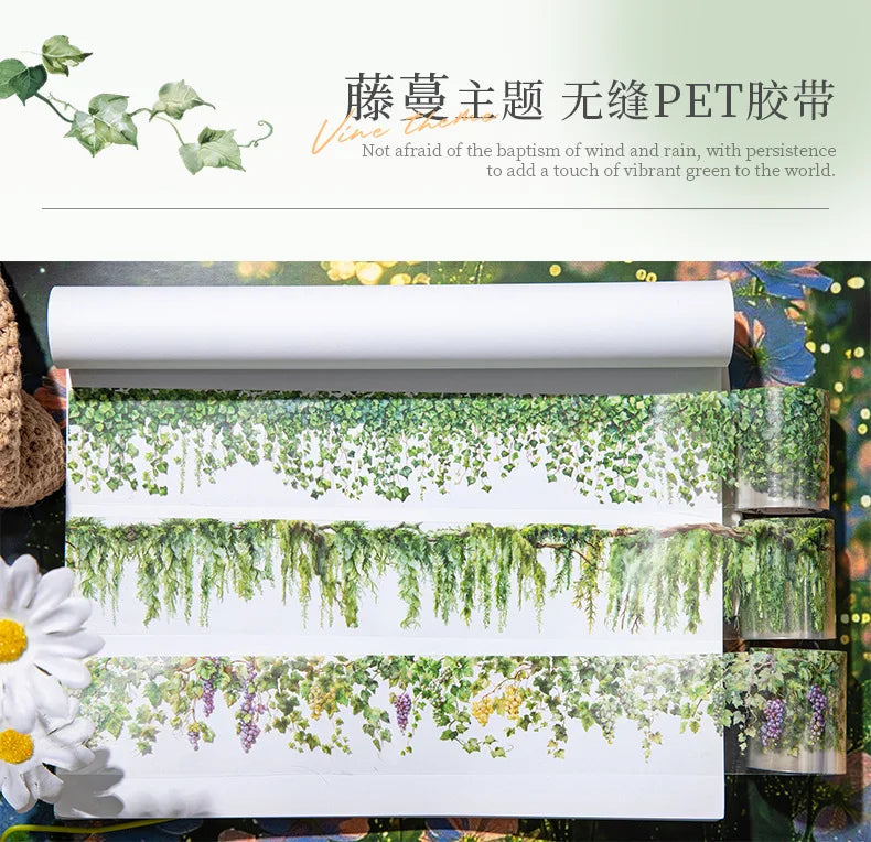 Rolls of green vine pattern PET tape for journaling and crafts displayed on a wooden surface.