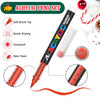 A set of black acrylic pens with red tips and a ruler, demonstrating waterproof and quick-drying features.