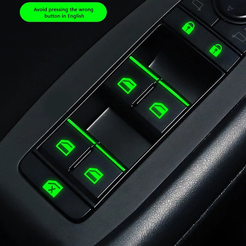 Close-up of a black car window control panel showing several green button stickers for operation